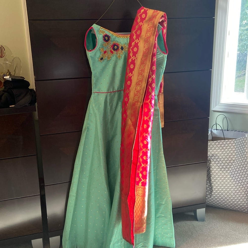 Green Indian suit for girls with pink pants and pink and gold dupatta